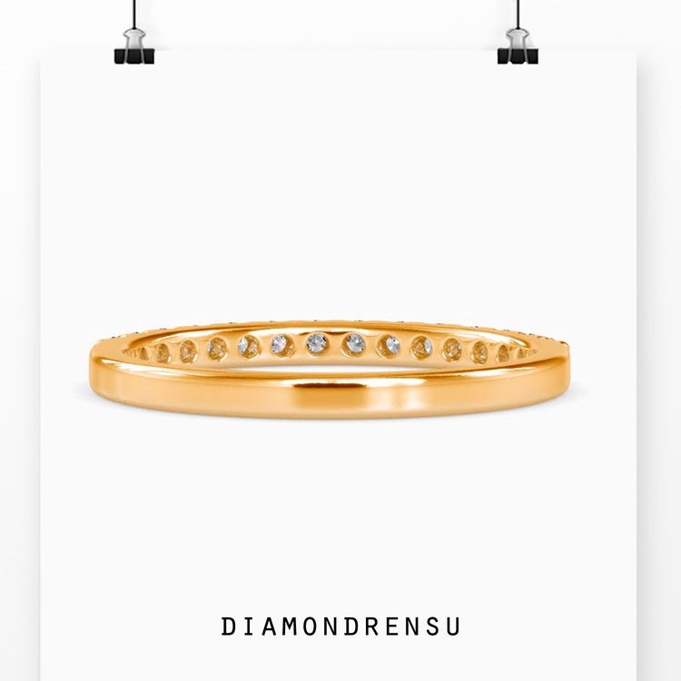 Lab grown diamond band in classic prong setting.
