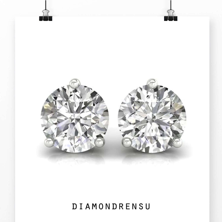 Lab grown diamond earrings with round cut stones and 3 prong setting in white gold.
