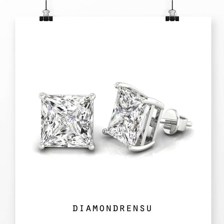 Elegant princess cut diamond stud earrings with gold prong setting.
