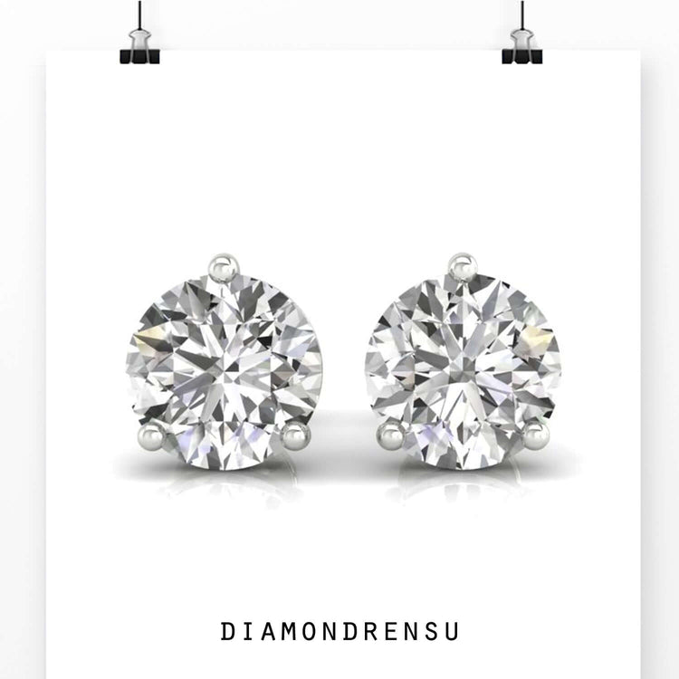 Round cut diamond earrings secured with screw backs.
