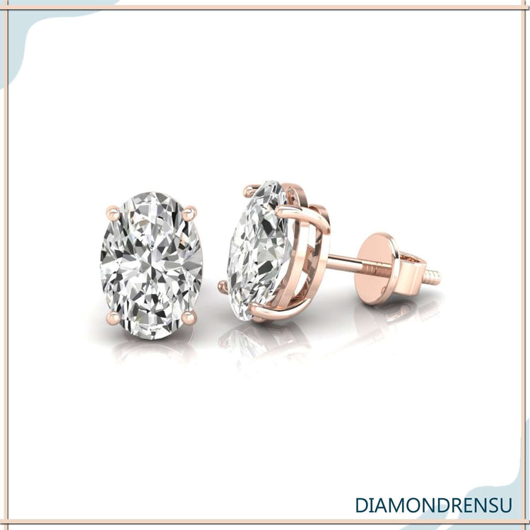 White gold oval cut diamond earrings with screw back closure.
