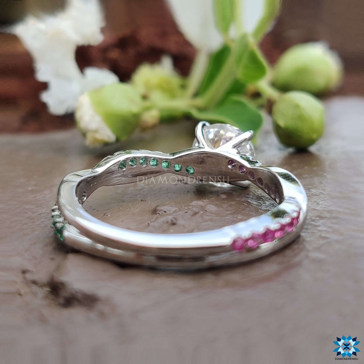 Twisted shank engagement ring with moissanite and side gems.
