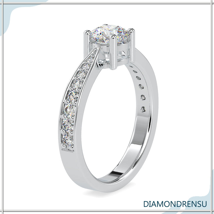 Rose gold diamond ring with round cut centre stone.
