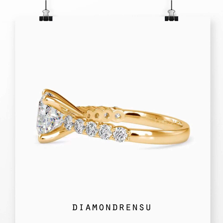 Yellow gold diamond ring with 4 prong cushion setting.
