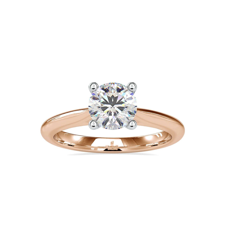 White gold engagement ring with round cut and tapered shank.
