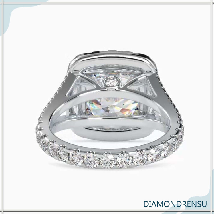 Custom design ring in yellow gold with round halo.
