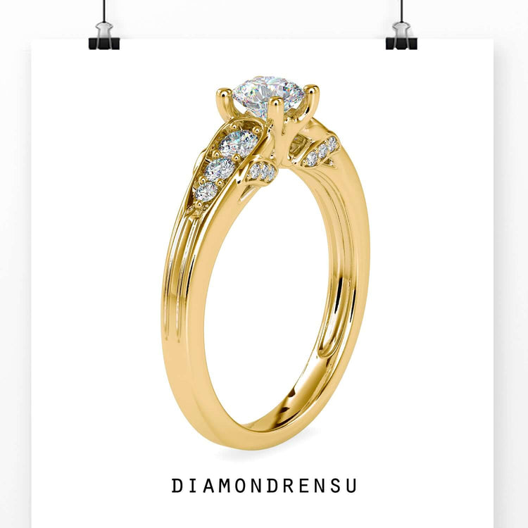 Custom engagement ring with tapered band and round side stones.
