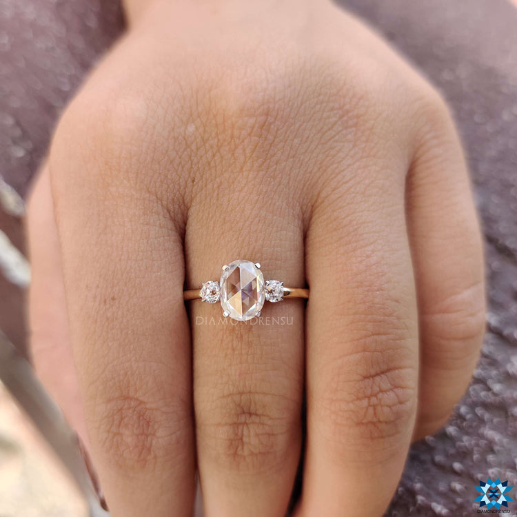 Two-tone moissanite ring in yellow and white gold with 4 tab prong setting.

