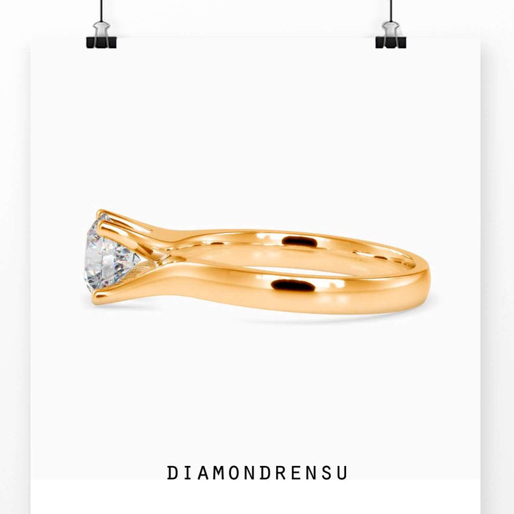Diamondrensu UK engagement ring in bypass gold setting.
