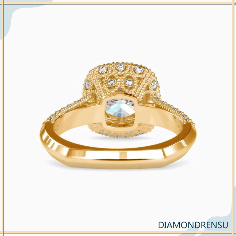 White gold ring with double halo and pave side stones.
