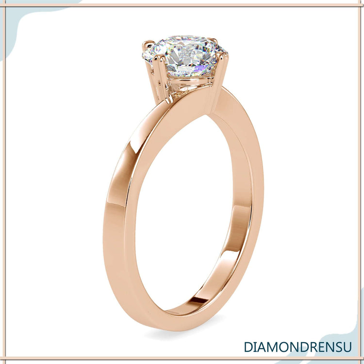 Handmade ring with round diamond and heart prong setting.
