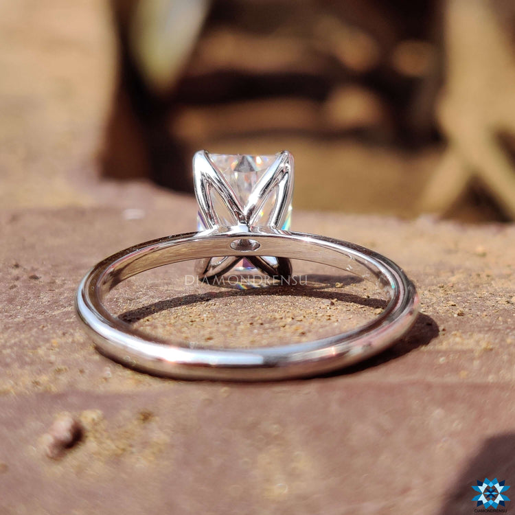 Moissanite engagement ring featuring radiant cut in white gold.
