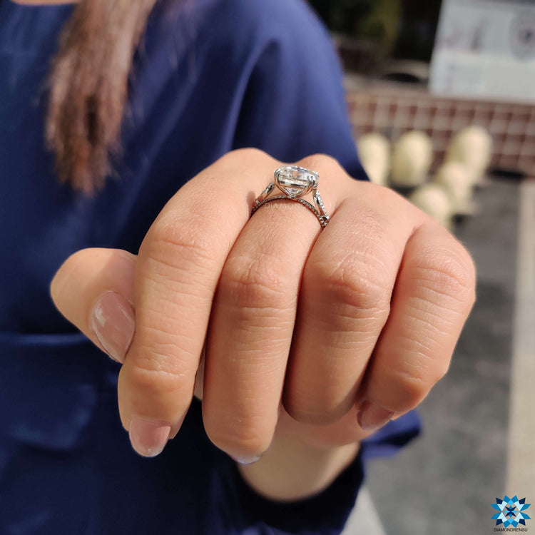 Handmade oval engagement ring with double claw prong and vintage look.
