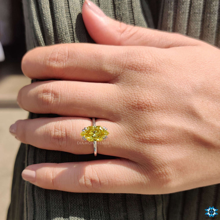 Round cut hidden halo setting in white gold.
