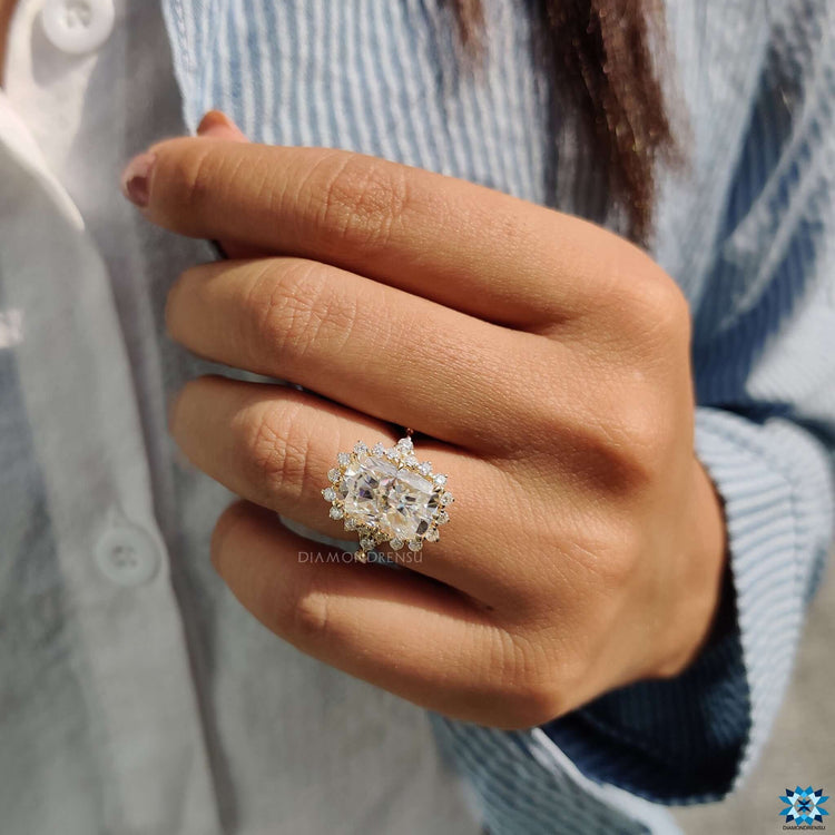 Milgrain cushion engagement ring with gold band.
