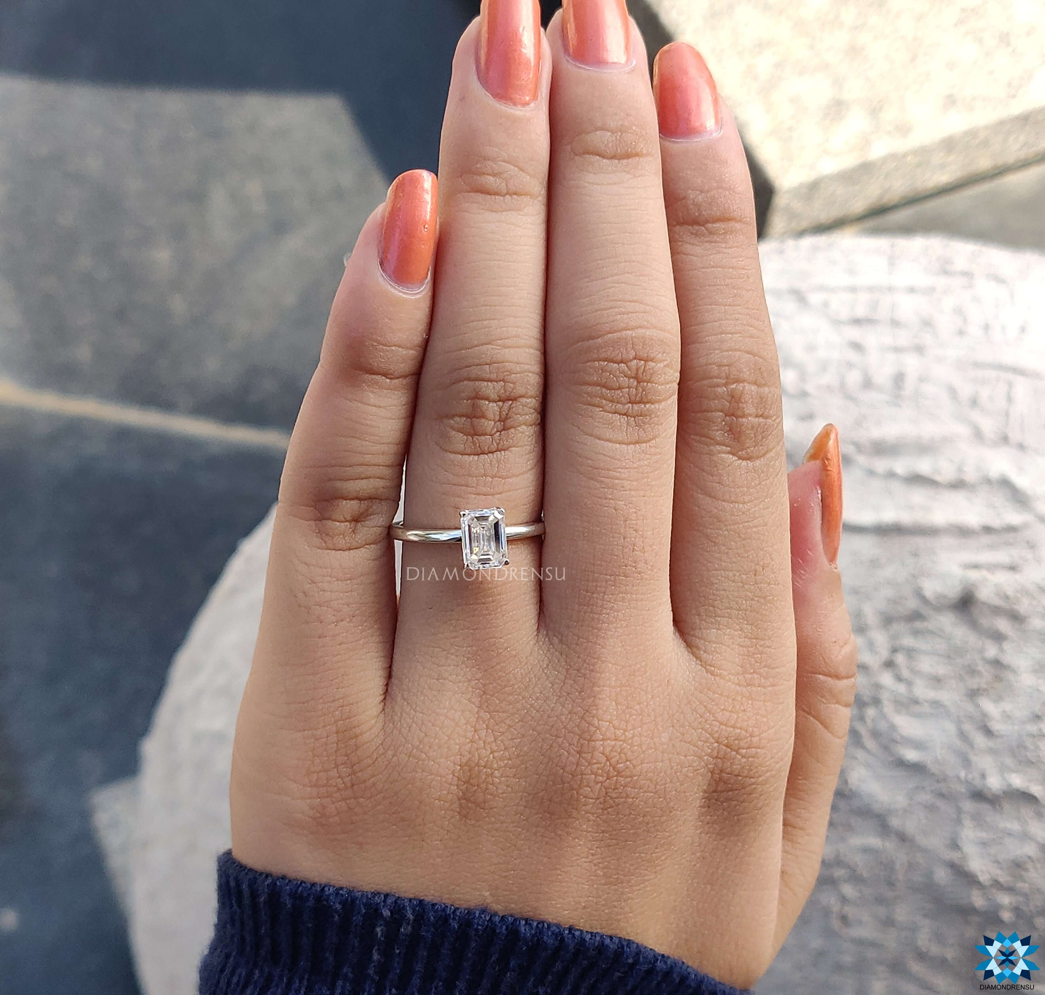 Handmade jewellery featuring an emerald cut moissanite for a luxurious touch.
