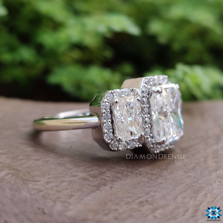 Three stone engagement ring with hidden halo design.
