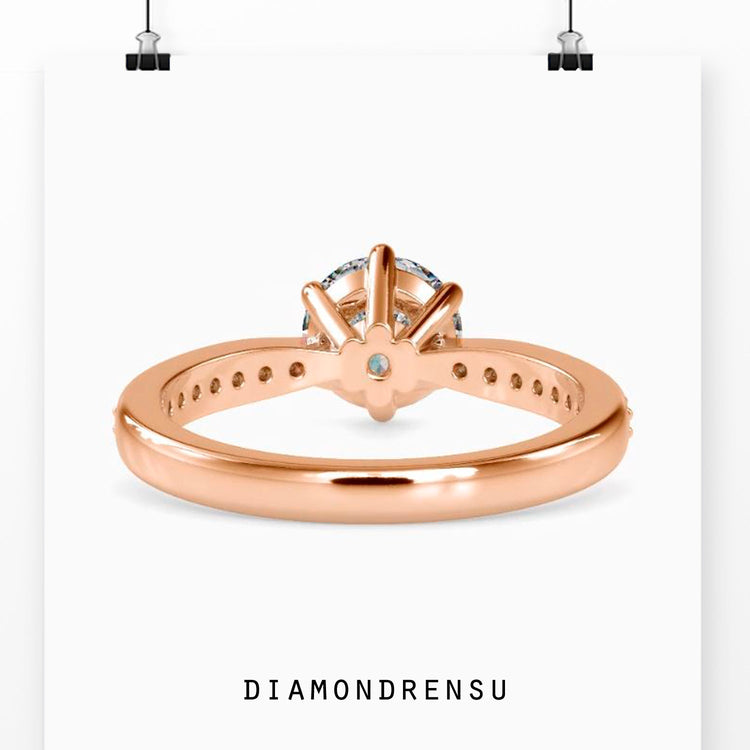 Handmade ring with round cut diamonds in a six prong mount.
