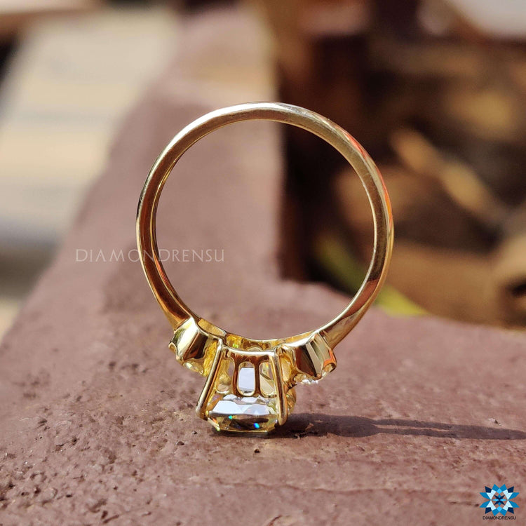 Custom three stone moissanite ring designed with historic-inspired cushion and round cuts.

