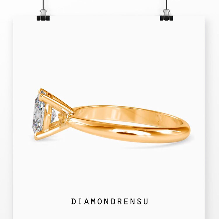 Rose gold handmade oval diamond solitaire ring.
