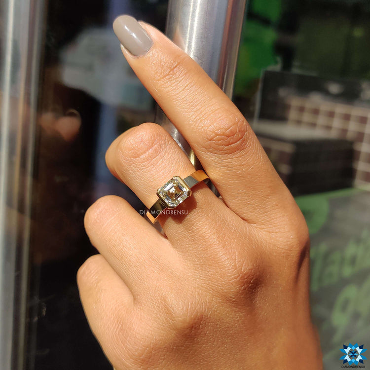 Handmade jewelry with yellow gold Asscher cut ring.
