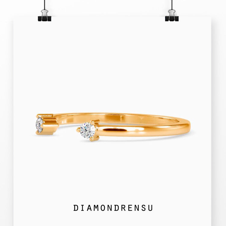 Yellow gold open gap band featuring round prong setting.
