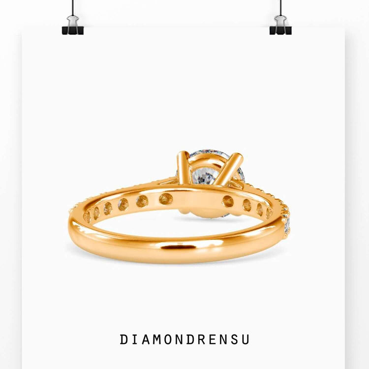 Lab grown diamond ring in yellow gold with cathedral setting.
