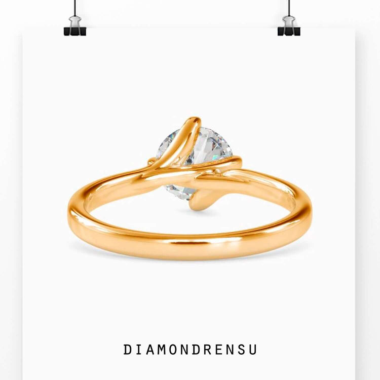 Rose gold engagement ring with handmade detail.
