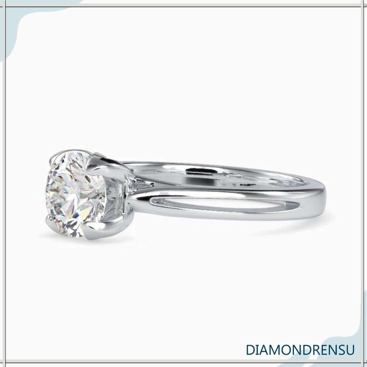 Lab grown diamond solitaire ring set in a petal prong mount.
