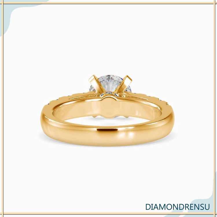 UK engagement ring with white gold band and round setting.
