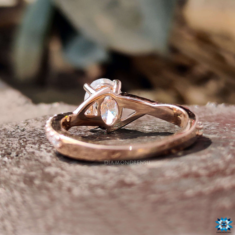 Moissanite engagement ring with pave band.
