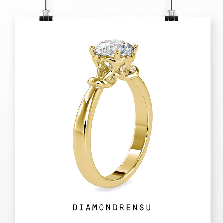 White gold engagement ring with round prong setting and lab diamond.

