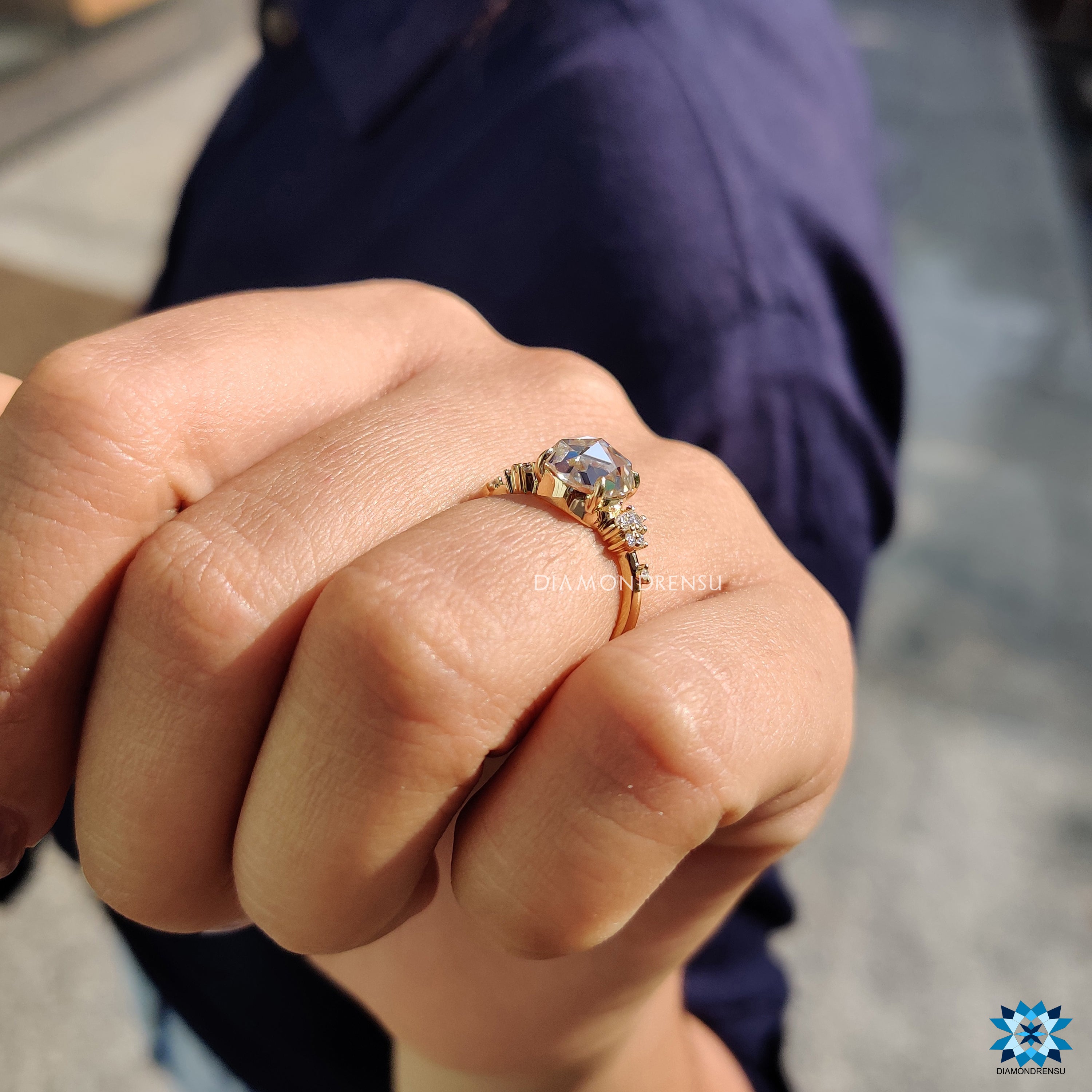 Moissanite engagement ring crafted with rose cut stone and muse setting.
