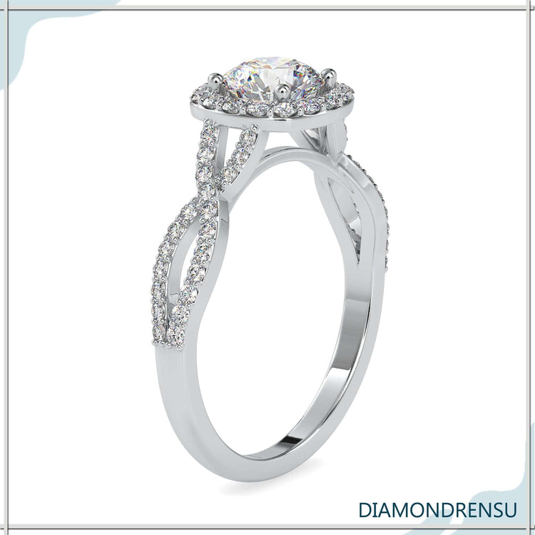 Round cut diamond set in twisted white gold engagement ring.
