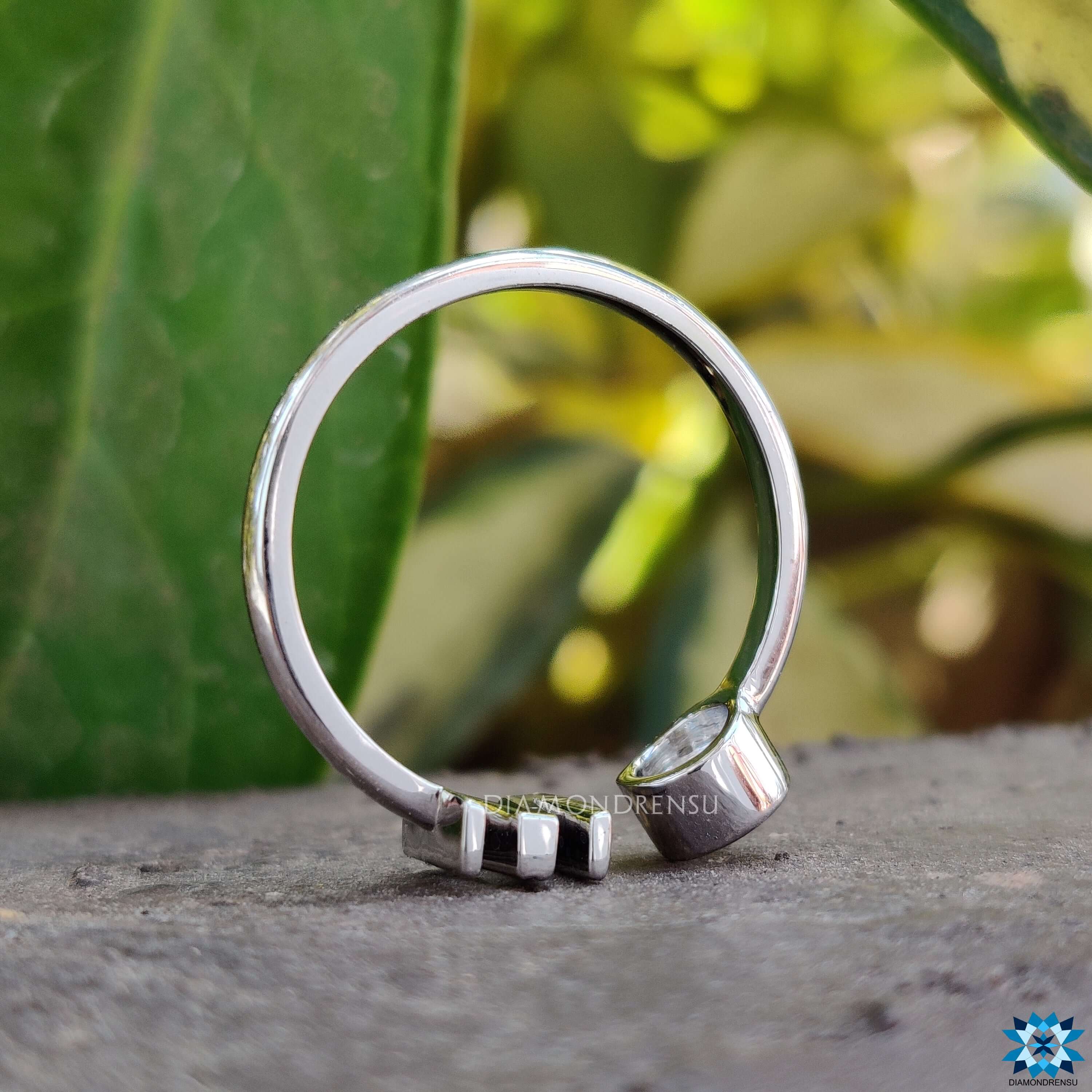 Sleek bezel set moissanite ring for a minimalist yet elegant look.
