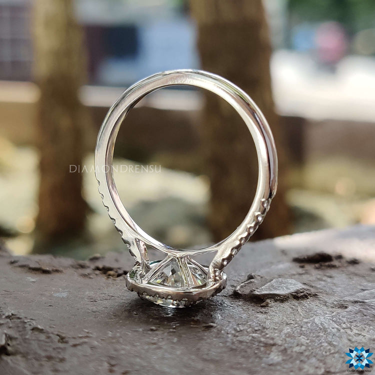 Round cut pave band paired with a halo cushion cut moissanite centre.
