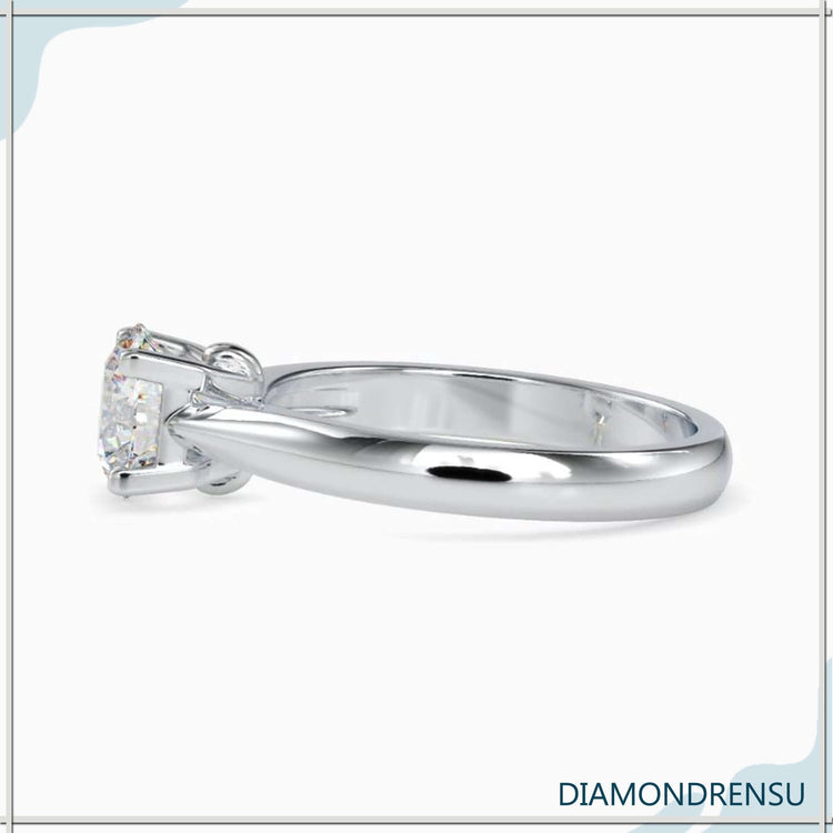 Stylish round solitaire engagement ring crafted in white gold for a sleek, modern look.

