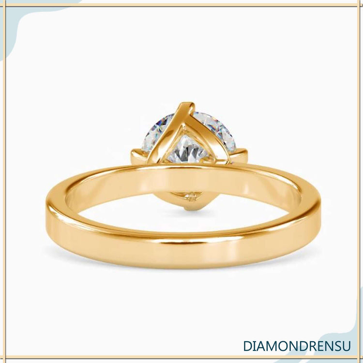 UK engagement ring with tab prong and antique diamond look.
