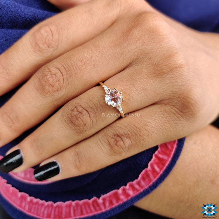 Muse setting engagement ring with a rose cut centre in yellow gold.
