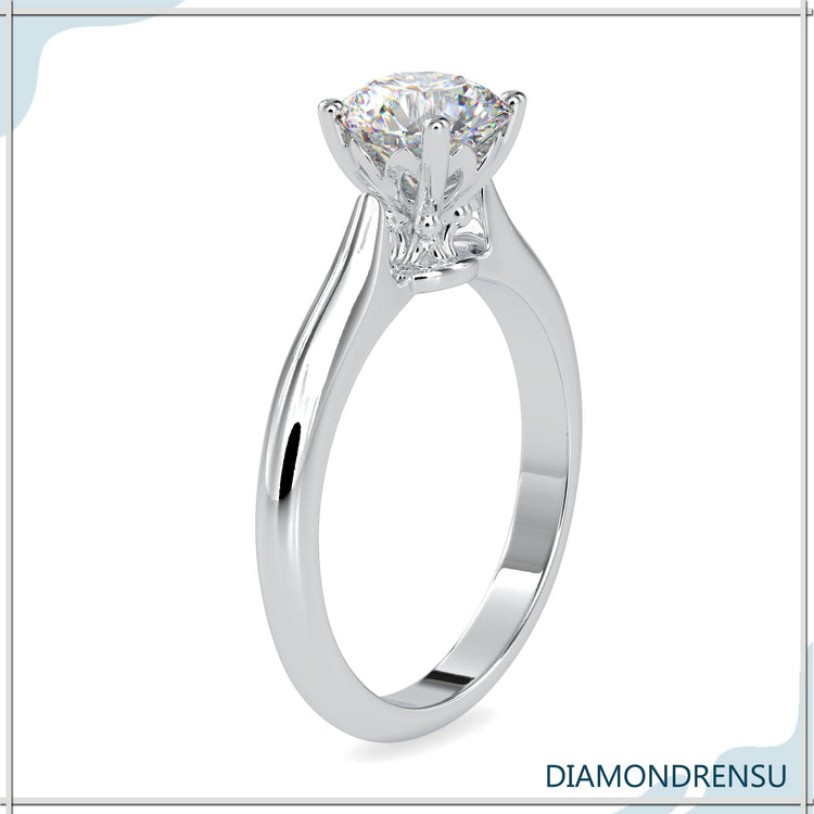 White gold ring with knife edge and lab grown diamond.
