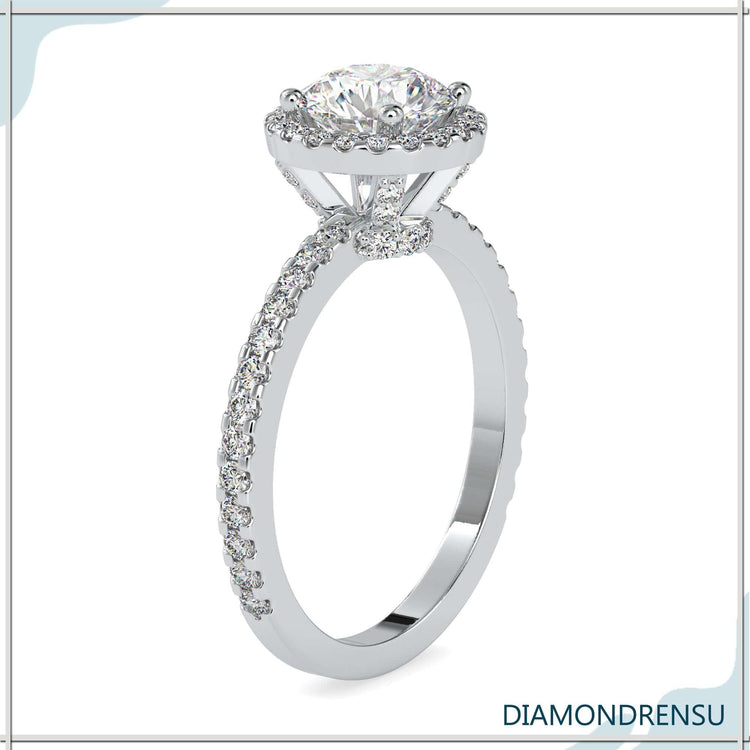 Rose gold diamond ring with round cut and pave detail.
