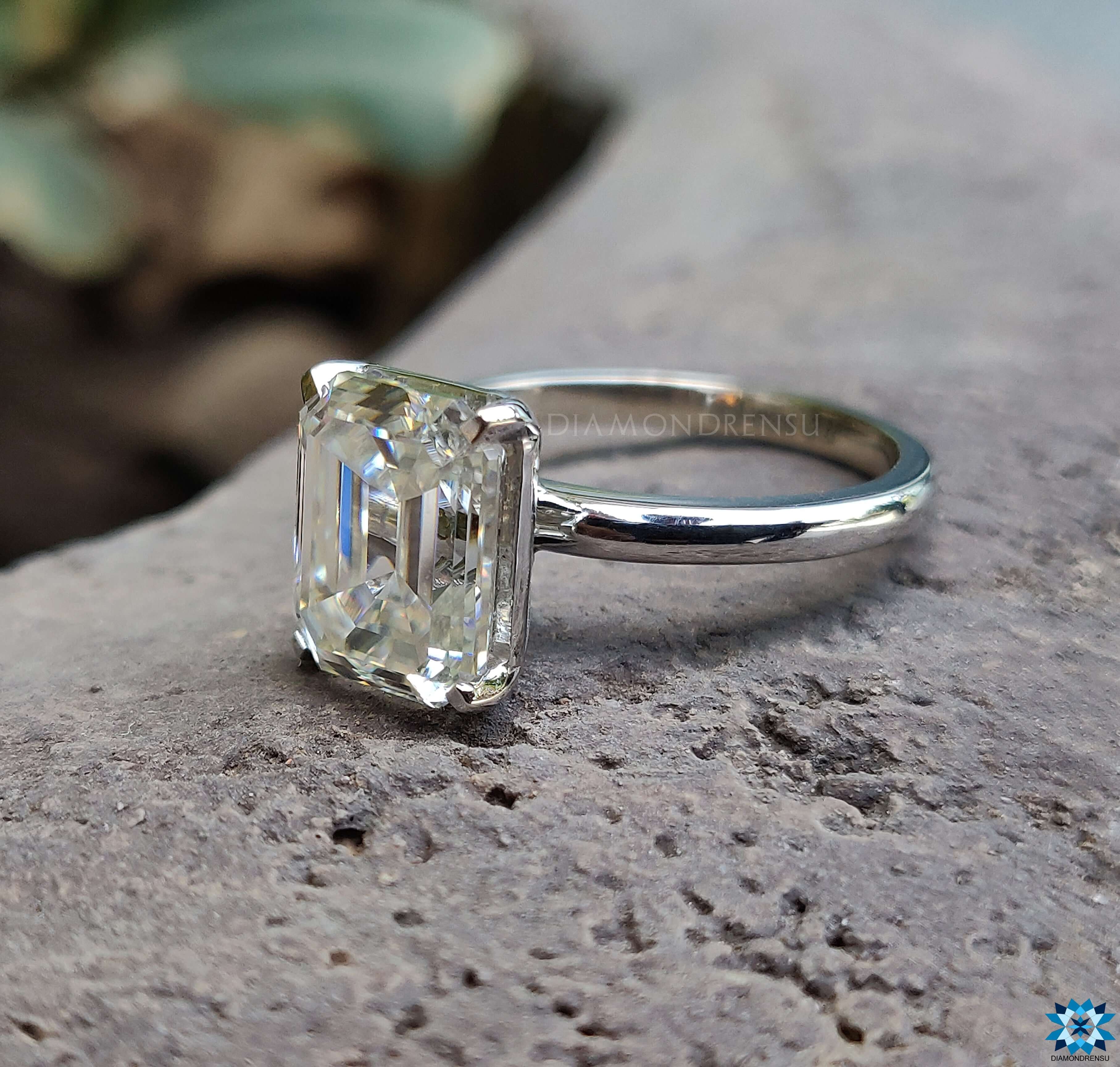 Prong setting ring showcasing a stunning Emerald Cut Moissanite Ring.