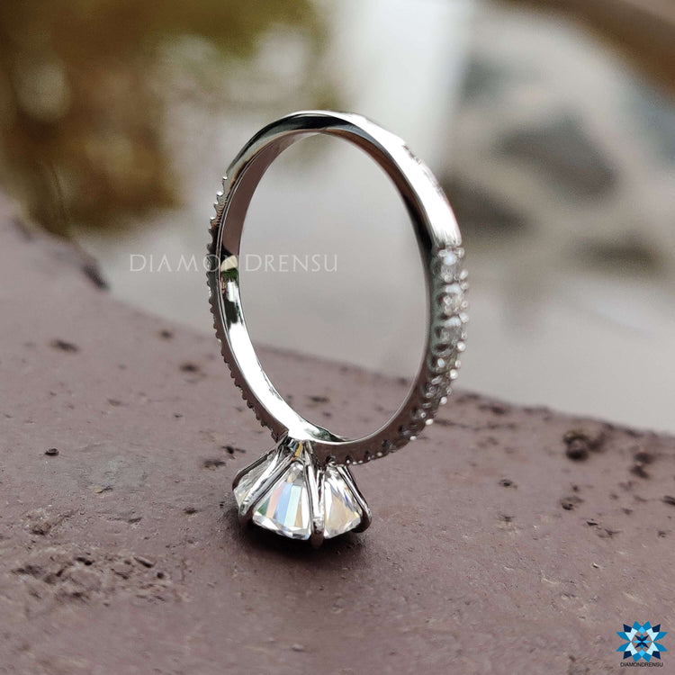 Six claw prong ring with octagon cut moissanite.
