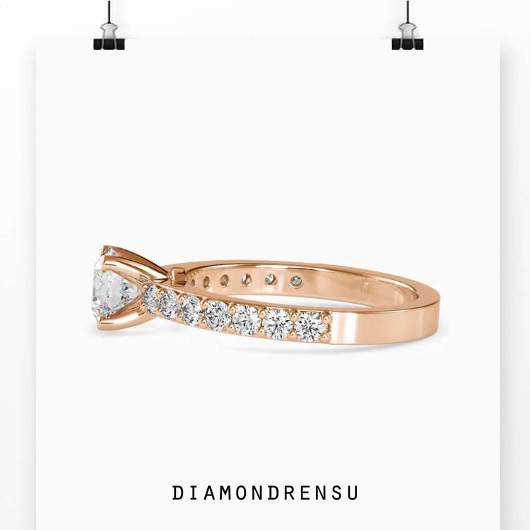 Yellow gold engagement ring with handmade prong setting.
