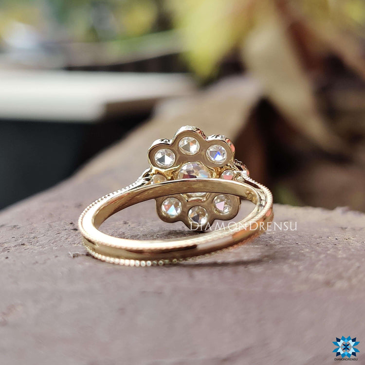 Antique-style moissanite ring with rose cut center stone.
