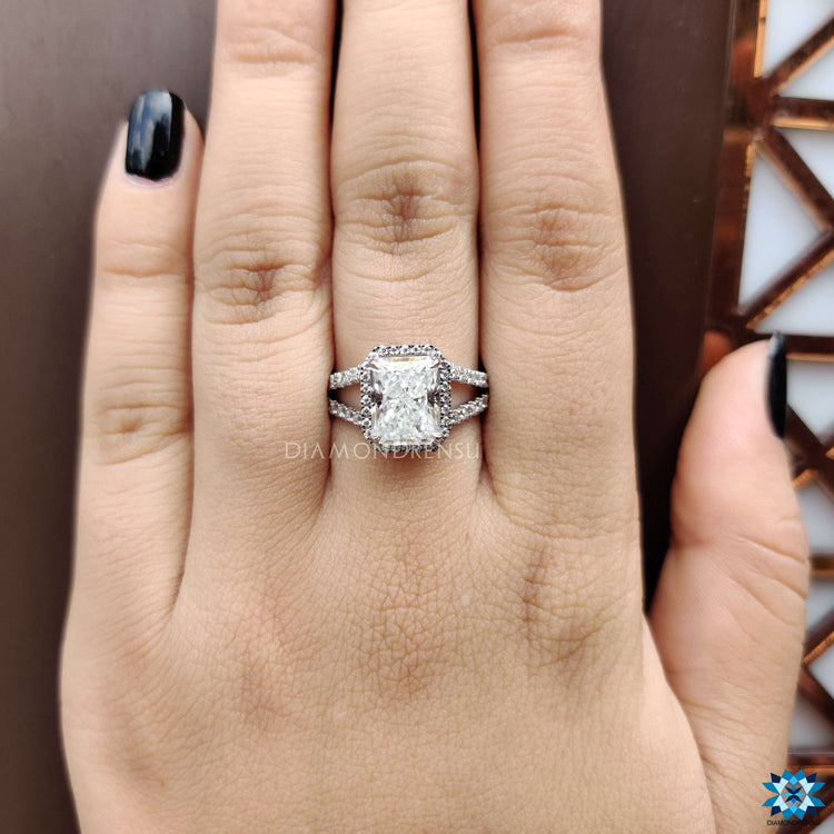 Split shank radiant moissanite ring in prong setting.
