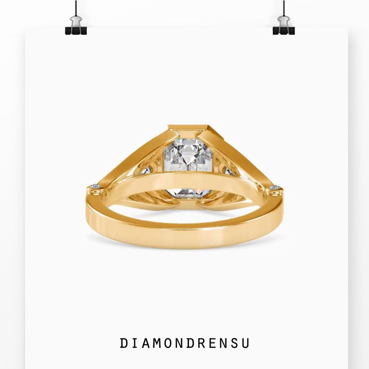 Custom design ring with three stone setting and bezel mount.
