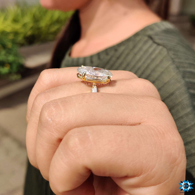 Handmade jewelry featuring moval cut moissanite ring with pave setting.
