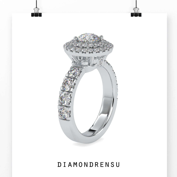 Lab grown diamond ring with halo round design and round side stones.
