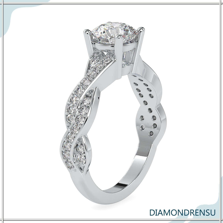 Designer ring in white gold featuring twisted band design.
